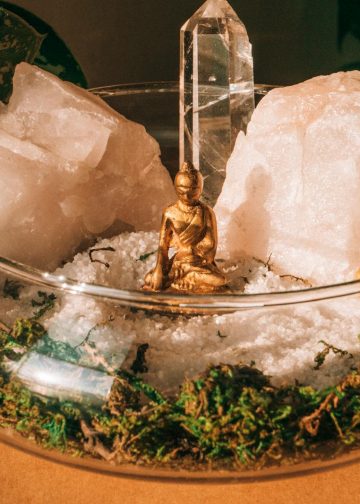 Buddha and Crystals on Clear Glass Bowl
