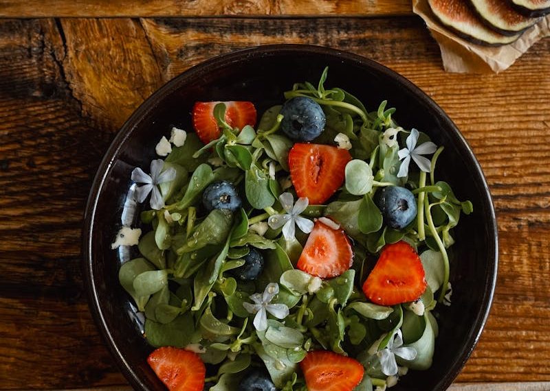 Organic Salad with Strawberries, Blueberries, Herbs and Edible Flowers