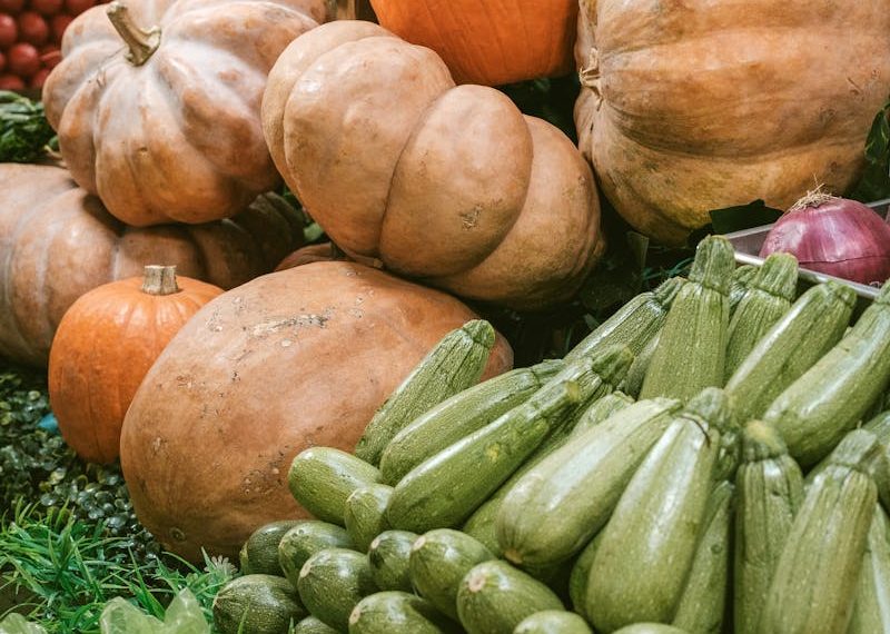 Vibrant Market Display of Pumpkins and Zucchinis