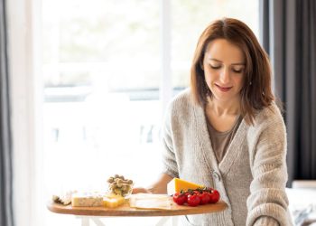 Woman Preparing Food On The Table