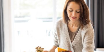 Woman Preparing Food On The Table