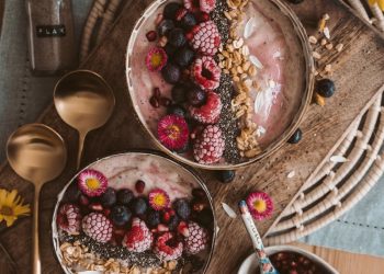 Red and White Round Fruits on Brown Wooden Bowl