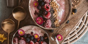 Red and White Round Fruits on Brown Wooden Bowl