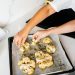 Hands of Persons Holding Baked Cauliflower