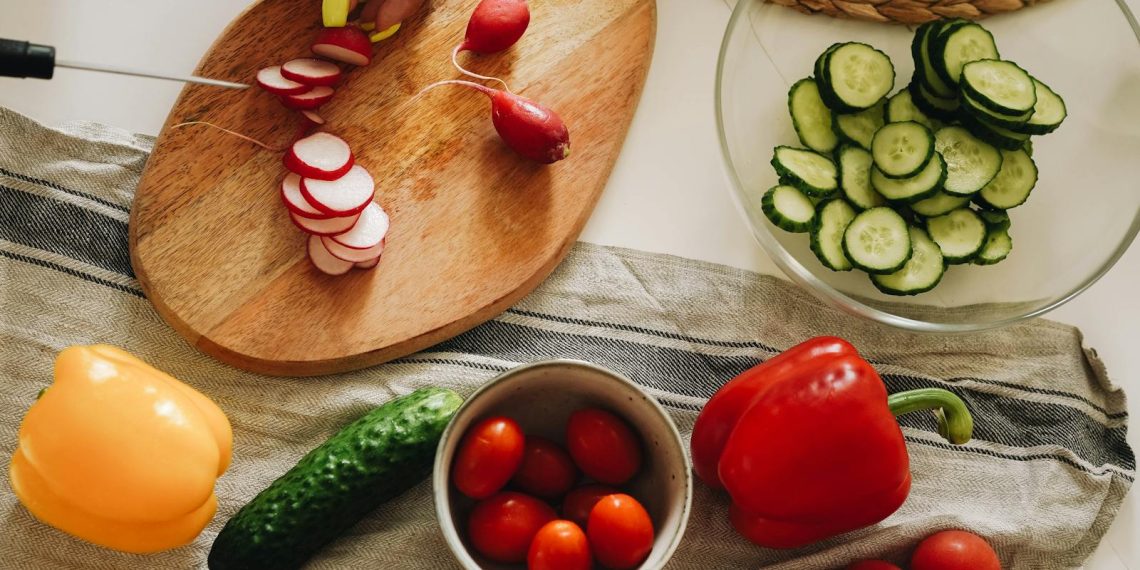 Sliced Tomato and Cucumber on Brown Wooden Chopping Board