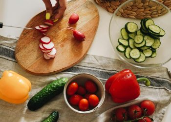 Sliced Tomato and Cucumber on Brown Wooden Chopping Board