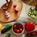 Sliced Tomato and Cucumber on Brown Wooden Chopping Board